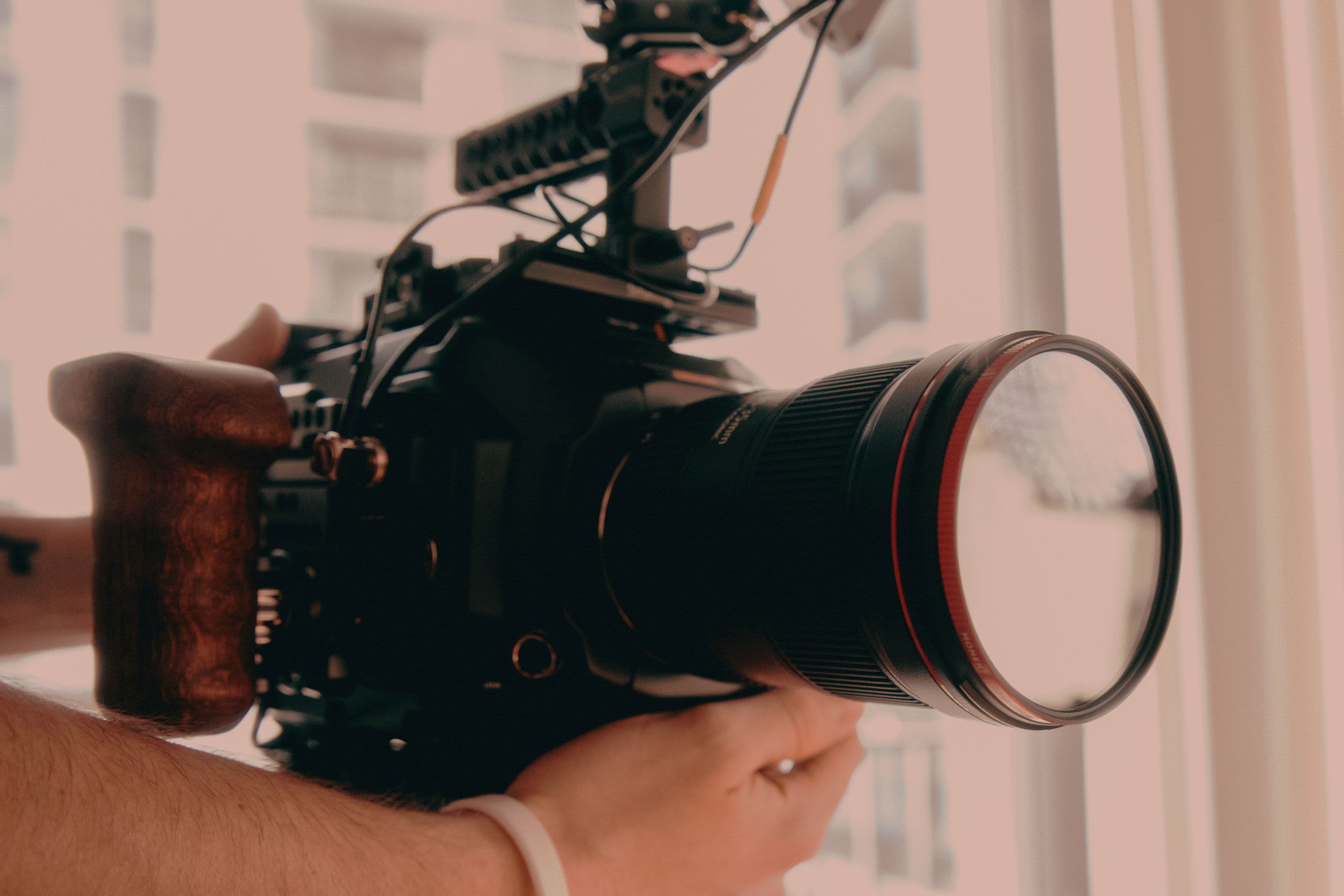 person holding black dslr camera